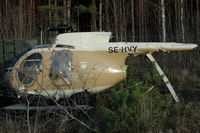 SE-HVY @ ESKN - Hughes 369D wreckage stored at Nyköping Skavsta airport, Sweden.  On October 4, 2005, it was substantially damaged when it collided with terrain after takeoff from Hangelosa, Sweden. The pilot received minor injuries. Compressor failure. - by Henk van Capelle