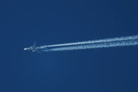 ZK-OKP @ EGCC - Air New Zealand B777 in the Hobbit colour scheme high over Manchester airport - by Chris Hall