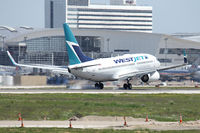 C-FWSY @ DFW - WestJet's first flight landing at DFW Airport - by Zane Adams