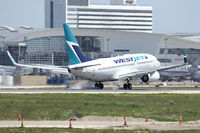 C-FWSY @ DFW - WestJet's first flight landing at DFW Airport