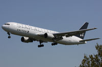 N653UA @ EGLL - United Airlines, on approach to runway 27L. - by Howard J Curtis