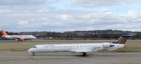 D-ACNX @ EGPH - Eurowings CRJ900 Taxiing to runway 06 on a germanwings flight to CGN ,With an Easyjet A320-214 G-EZUS Already lined up for departure - by Mike stanners