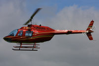 G-GBRU @ EGBT - being used for ferrying race fans to the British F1 Grand Prix at Silverstone - by Chris Hall