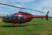 G-GBRU @ EGBT - being used for ferrying race fans to the British F1 Grand Prix at Silverstone - by Chris Hall