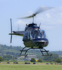 G-TFHW @ EGFP - Bell 206B operated by Fly Heli Wales Ltd ready to set down at Pembrey. - by Derek Flewin