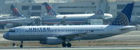 N483UA @ KLAX - United, seen here waiting for crossing clearence RWY 25R at Los Angeles Int´l(KLAX) - by A. Gendorf