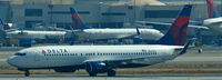 N399DA @ KLAX - Delta, seen here waiting for RWY-crossing clearence after landing at Los Angeles Int´l(KLAX) - by A. Gendorf