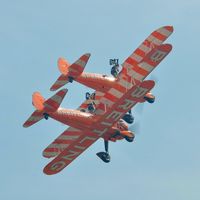 N707TJ - Off airport. Breitling 4 (N707TJ) leading the  two ship formation of the Breitling Wingwalking team displaying on the first day of the Wales National Air Show, Swansea Bay, UK. - by Roger Winser