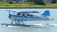 C-FJFQ @ CYVR - Van City Seaplanes #200 taxiing to takeoff position on the Fraser River. - by M.L. Jacobs