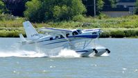 C-FTEL @ CYVR - Private Telus Kodiak taking off on the Fraser River. - by M.L. Jacobs
