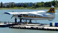 C-GLCP @ CYVR - Harbour Air #311 being refueled at the YVR Seaplane Terminal. - by M.L. Jacobs