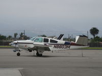 N8803M @ OXR - 1964 Beech S35 BONANZA, Continental IO-520-B 285 Hp, cute pinup on the cowl - by Doug Robertson