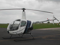 G-JARA @ CAX - Robinson R22 Beta of Northumbria Helicopters Ltd seen at Carlisle in May 2004. - by Peter Nicholson