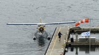 C-FFHQ @ CYHC - Harbour Air #203 arriving at Coal Harbour terminal on a rainy morning. - by M.L. Jacobs