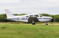 G-JACA @ EGFH - Visiting Cherokee Warrior III operated by the Pilot Centre at Denham Aerodrome. - by Roger Winser