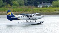 C-GHAR @ CYVR - Harbour Air #308 just landed on the Fraser River. - by M.L. Jacobs