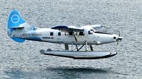 C-GHAS @ CYHC - Harbour Air #310 about to touch down in Coal Harbour under overcast skies. - by M.L. Jacobs