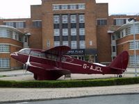 BAPC280 @ EGGP - This replica Dragon Rapide is outside the entrance to the Crowne Plaza hotel situated in the old terminal building at Liverpool Airport. - by Guitarist