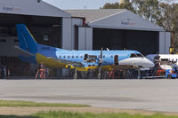 VH-ZJS @ YSWG - Regional Express Saab 340B (VH-ZJS) in former Happy Air Travellers livery at the REX maintenance hangar at Wagga Wagga Airport. - by YSWG-photography