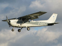 C-GOYJ @ CYKZ - As torn & frayed clouds swirled above this nice Skyhawk was about to land on 33. I've always liked the colour of this busy plane that's owned by the Toronto Airways flying club. - by Chris Coates