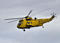 XZ599 @ EGOQ - Sea King HAR.3 Coded  P, C Flight 22 Sqn in the circuit at RAF Mona Anglesey. - by Derek Flewin