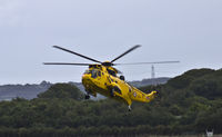 XZ599 @ EGOQ - Sea King HAR.3 Coded P, C Flight 22 Sqn doing fast run in and stops at RAF Mona Anglesey. - by Derek Flewin
