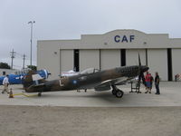 N749DP @ CMA - 1983 Vickers/Supermarine SPITFIRE Mk XIV, Rolls Royce Griffon 65 V-12 2,050 Hp, ex David Price, rebuild on CAF ramp - by Doug Robertson