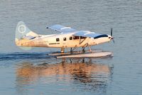 C-GHAS @ CYHC - Harbour Air #310 departing Coal Harbour terminal shortly after sunrise. - by M.L. Jacobs