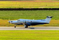 N425EV @ KGFK - Pilatus PC-12 landing on runway 17R. - by Kreg Anderson