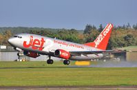 G-CELW @ EGHH - Lifting off a wet 26 departing after respray - by John Coates