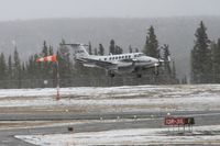 C-FLPC @ CYXY - Landing at Whitehorse, Yukon, in gusty winds and mixed rain and snow. - by Murray Lundberg
