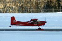 C-GLFW @ CYXY - Taking off at Whitehorse, Yukon, equipped with wheel-skis. - by Murray Lundberg