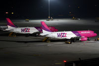 HA-LPV @ LOWW - Wizz Air Airbus A320 with HA-LPF in the background - by Andreas Ranner