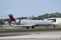 N753EV @ KSRQ - Delta Flight 4935 operated by ExpressJet (N753EV) arrives at Sarasota-Bradenton International Airport following a flight from LaGuardia Airport - by Donten Photography