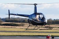 G-MDKD @ EGFH - Resident R-22 Beta helicopter operated by Heli-air Wales.. - by Roger Winser