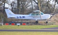 G-BJWI @ EGHH - Resident about to touchdown - by John Coates