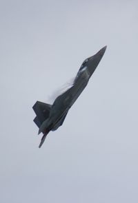 03-4042 - F-22 Raptor over Cocoa Beach - by Florida Metal