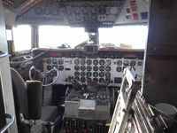 N7780B @ ENA - Cockpit of DC-6A of Everts Air Fuel  at Kenai Airport - by Jack Poelstra