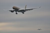 A9C-KD @ EGLL - Not as close as it appears..United 74 is on 27R - by John Coates