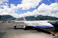 B-18273 @ VHHH - China Airlines Boeing B747-409 push back at Hong Kong International Airport. - by miro susta