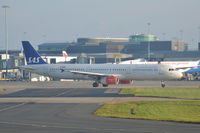 LN-RKK @ EGCC - Scandinavian Airlines LN-RKK Airbus A321-232 taxiing at Manchester Airport. - by David Burrell