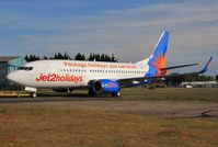 G-GDFN @ EGHH - Being towed from paintshop after repaint - by John Coates