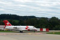 HB-JRA @ ZRH - Swiss Air Rescue (Rega) Bombardier airplane after landing at Zurich-Kloten International Airport, photo through airplane window. - by miro susta