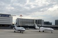 D-AHRN @ LSZH - Heron Aviation Falcon 900EX and DC Aviation Gulfstream G450 D-AABB) airplanes parking at Zurich-Kloten International Airport, photo through airplane window. - by miro susta