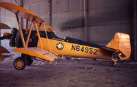 N64952 @ BMT - An M&M sprayer inside their hanger.  Still open cockpit. - by Larry Johnson