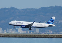 N827JB @ SFO - Landing at San Francisco - by Bill Larkins