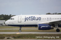 N665JB @ KSRQ - JetBlue Flight 163 (N665JB) Something About Blue arrives at Sarasota-Bradenton International Airport following a flight from John F Kennedy International Airport - by Donten Photography