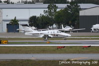 N500CD @ KSRQ - Eclipse 500 (N500CD) arrives at Sarasota-Bradenton International Airport following a flight from Page Field Airport - by Donten Photography