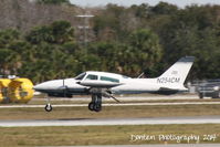 N254CM @ KSRQ - Cessna 310 (N254CM) arrives at Sarasota-Bradenton International Airport - by Donten Photography