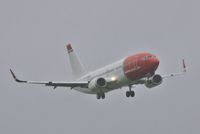 LN-KHA @ EGHH - Lining up for low approach in rotten weather - by John Coates